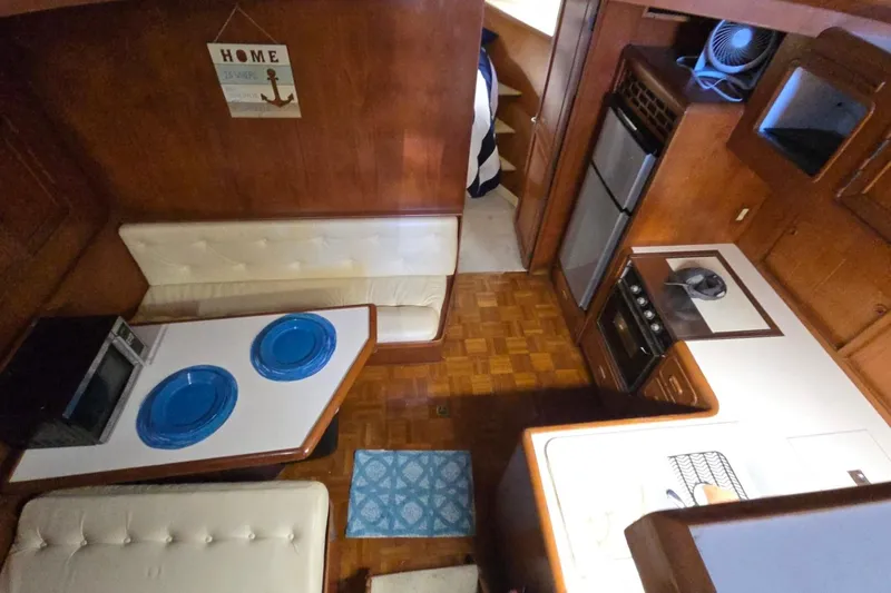 Slide: The Image of Interior of a 1990 Pace 42 yacht with kitchen and dining area. - 34