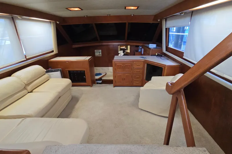 Slide: The Image of Luxurious interior of a 1990 Pace 42 yacht with beige seating and wooden accents. - 15
