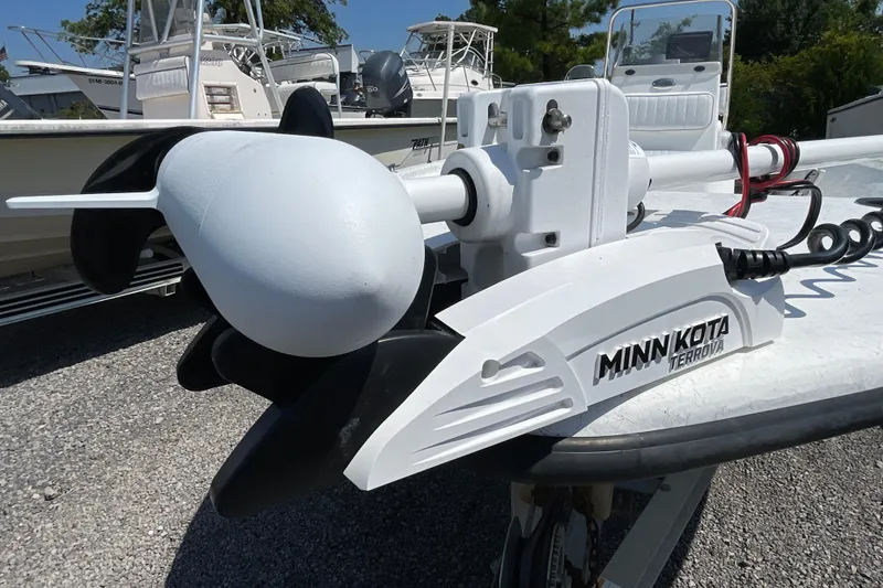 Slide: The Image of Minn Kota Terrova trolling motor on a 2006 Kenner 180 VX boat, parked outdoors. - 14