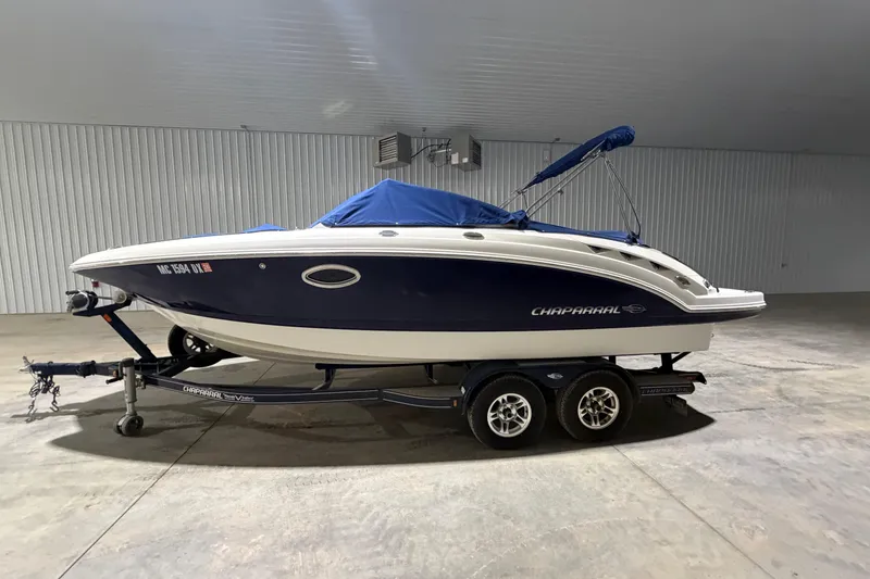 Slide: The Image of 2013 Chaparral 224 Sunesta boat on trailer in indoor storage. - 1