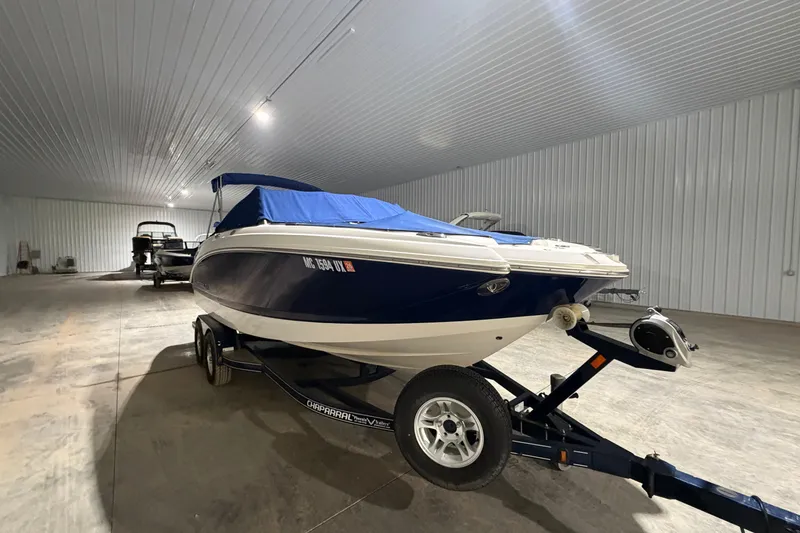 Slide: The Image of 2013 Chaparral 224 Sunesta boat in storage, covered and on a trailer. - 4