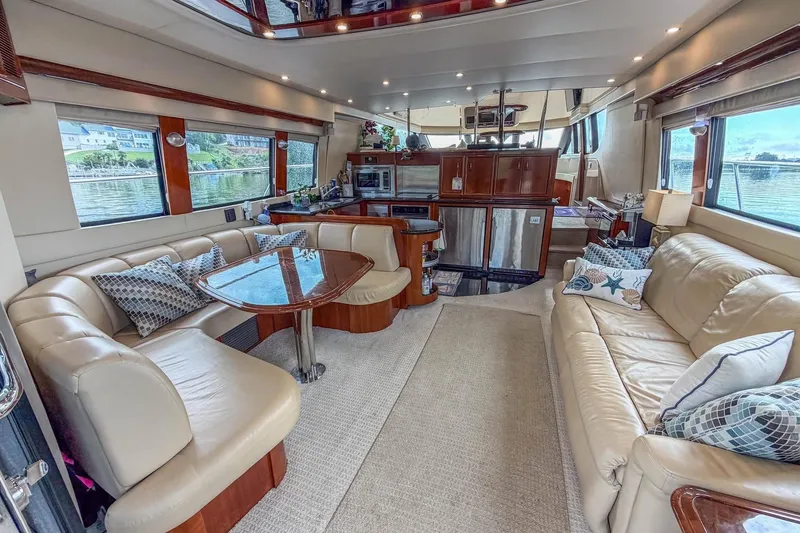Slide: The Image of Luxurious interior of a 2005 Carver 56 Voyager yacht with elegant seating and modern amenities. - 29