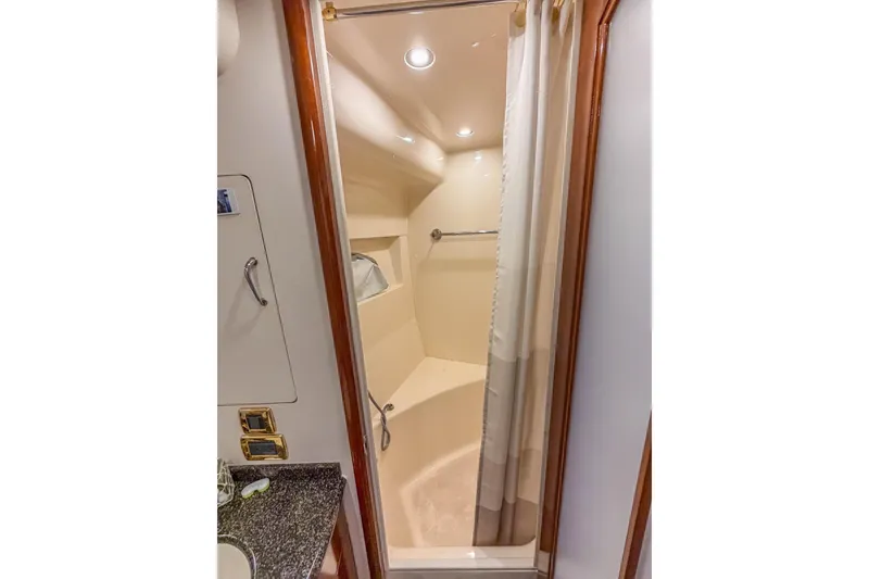 Slide: The Image of 2005 Carver 56 Voyager yacht bathroom with shower and granite countertop. - 24
