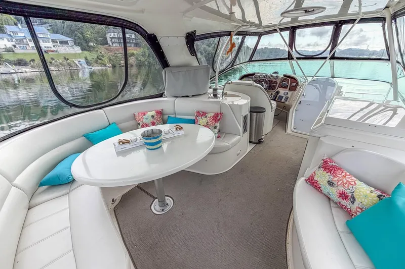 Slide: The Image of Luxurious 2005 Carver 56 Voyager yacht interior with plush seating and scenic views. - 40
