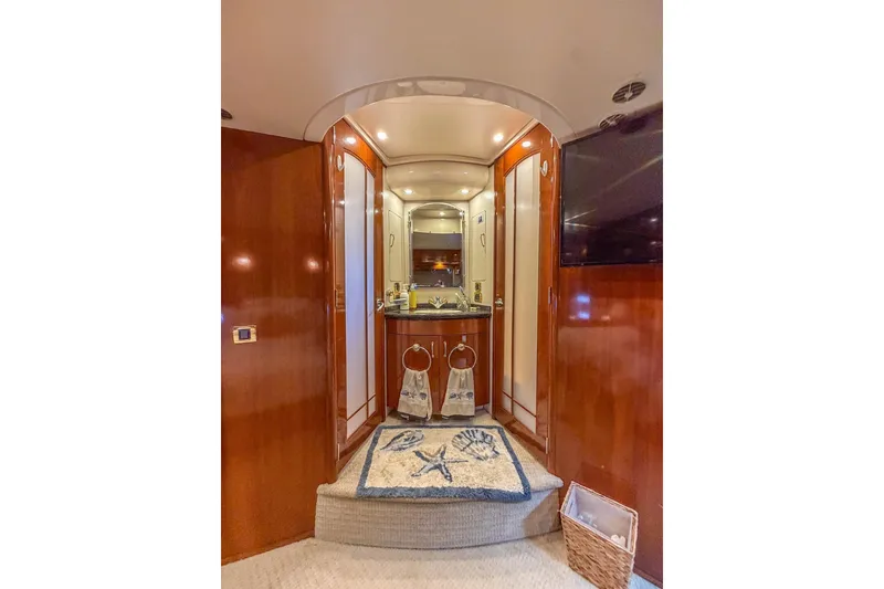 Slide: The Image of Luxurious interior of 2005 Carver 56 Voyager yacht with elegant wood finishes and nautical decor. - 22
