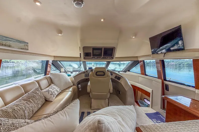 Slide: The Image of Luxurious interior of a 2005 Carver 56 Voyager yacht with plush seating and scenic views. - 27