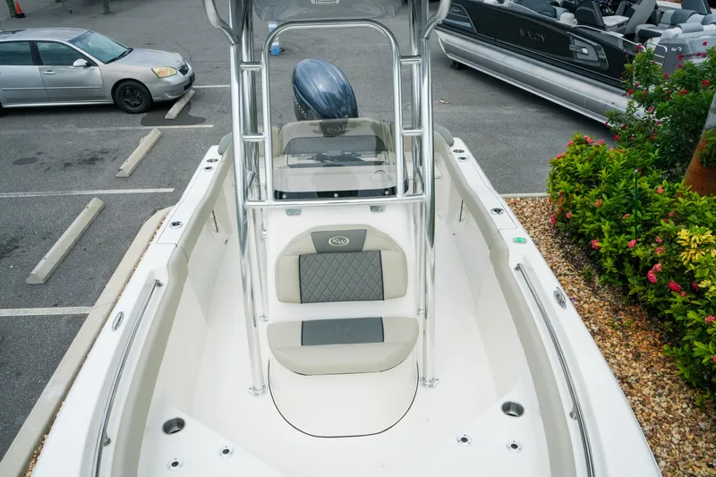 Slide: The Image of 2026 Key West 203 FS boat in parking lot, featuring sleek design and comfortable seating. - 18