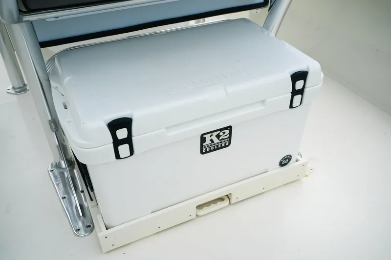 Slide: The Image of White K2 cooler on Key West 203 FS boat, 2026 model, secured with black latches. - 11