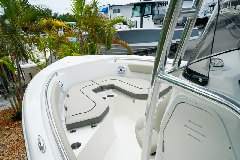 Slide: The Image of 2026 Key West 203 FS boat interior with cushioned seating and sleek design. - 23