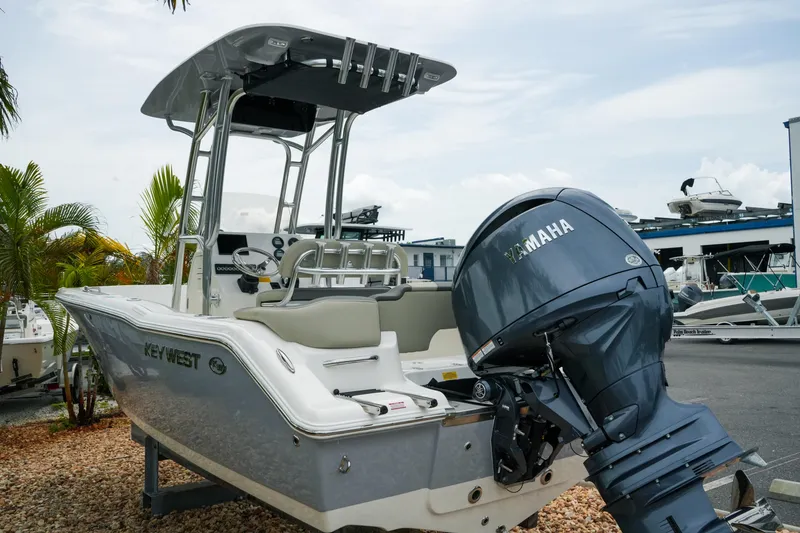 Slide: The Image of 2026 Key West 203 FS boat with Yamaha engine, parked outdoors. - 7