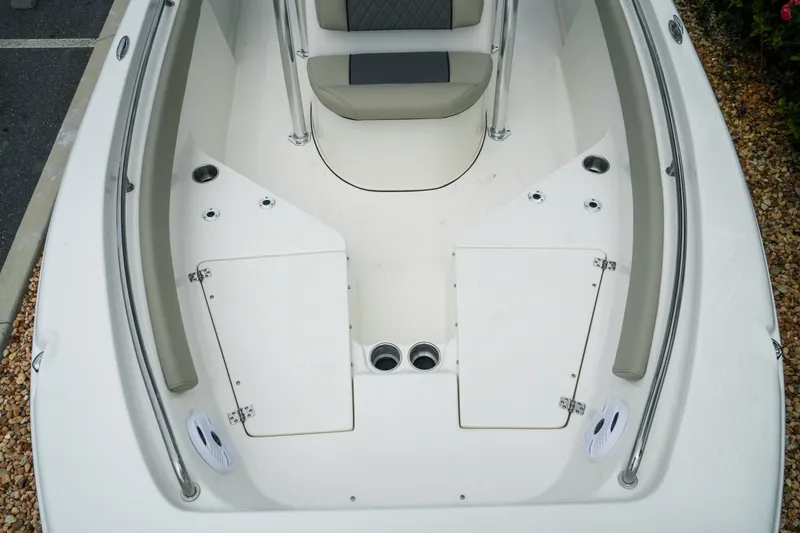 Slide: The Image of 2026 Key West 203 FS boat interior with seating and storage compartments. - 17
