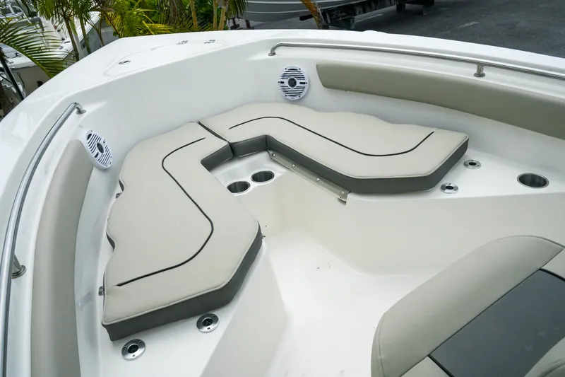 Slide: The Image of 2026 Key West 203 FS boat interior with cushioned seating and cup holders. - 24