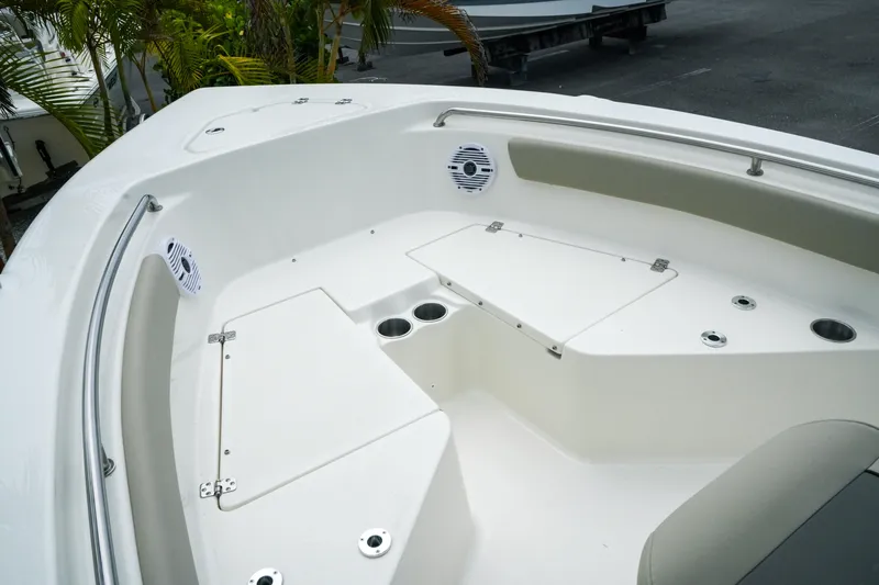 Slide: The Image of Bow seating area of 2026 Key West 203 FS boat with storage compartments. - 15
