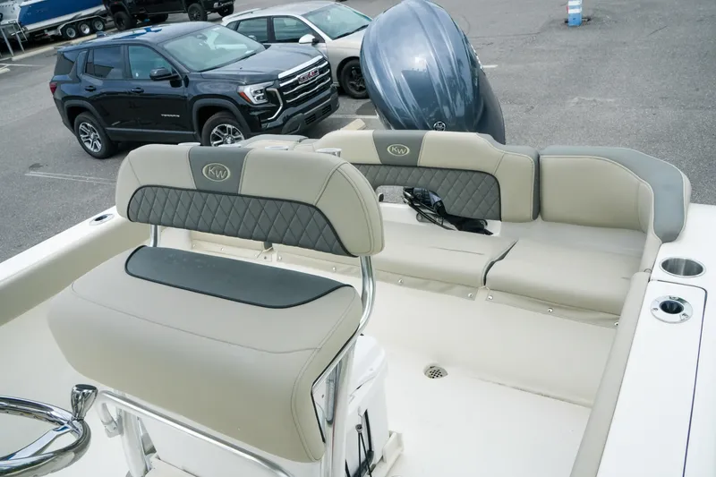 Slide: The Image of 2026 Key West 203 FS boat interior with cushioned seating and steering wheel. - 25