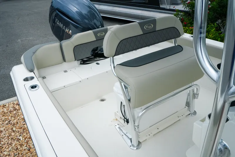 Slide: The Image of 2026 Key West 203 FS boat interior with seating and Yamaha engine. - 21