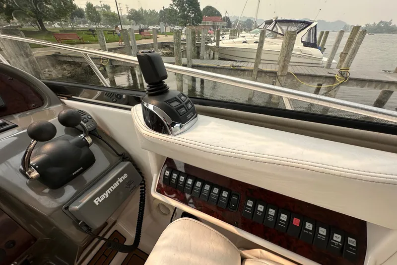 Slide: The Image of Interior of 2008 Regal Commodore 4060 yacht with control panel and Raymarine equipment. - 12