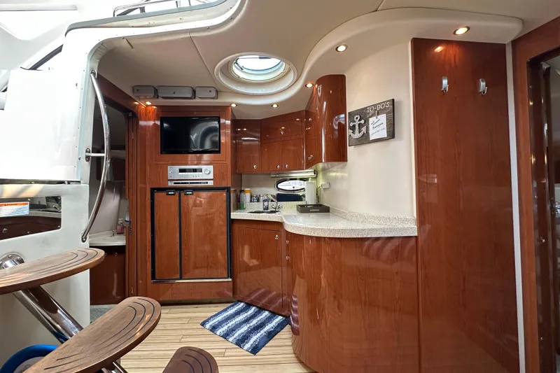 Slide: The Image of Luxurious interior of 2008 Regal Commodore 4060 yacht with wood cabinetry and modern amenities. - 16