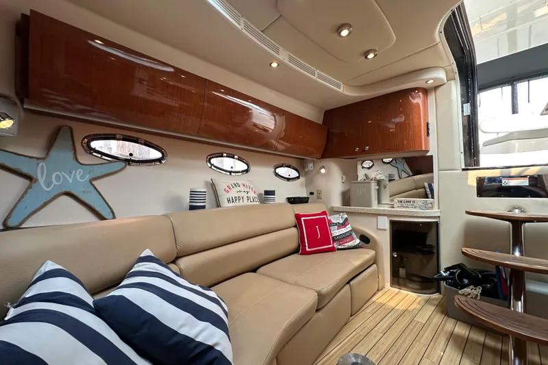 Slide: The Image of Luxurious interior of 2008 Regal Commodore 4060 yacht with cozy seating and nautical decor. - 15