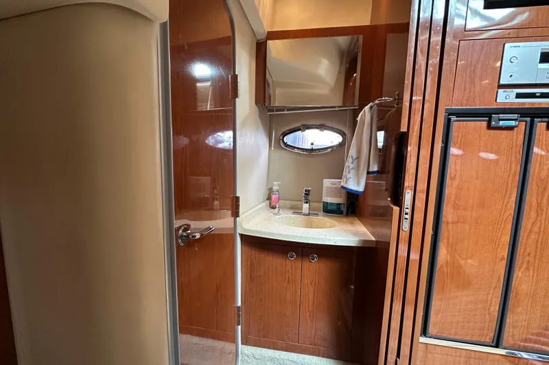 Slide: The Image of Luxurious bathroom interior of 2008 Regal Commodore 4060 yacht with wooden cabinetry. - 27