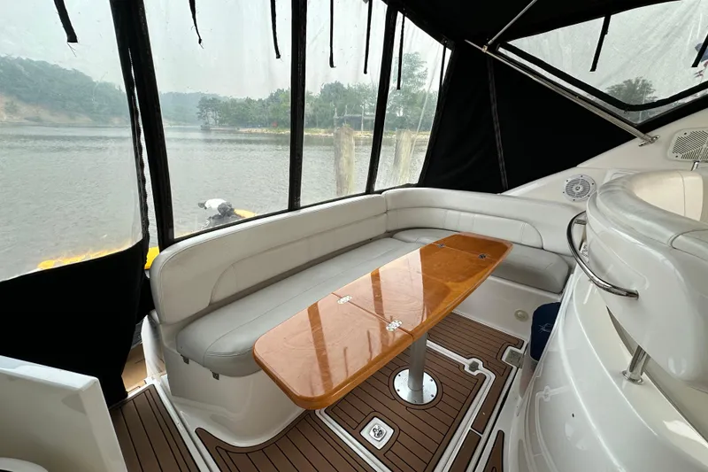 Slide: The Image of Interior of 2008 Regal Commodore 4060 yacht with elegant seating and wooden table. - 5
