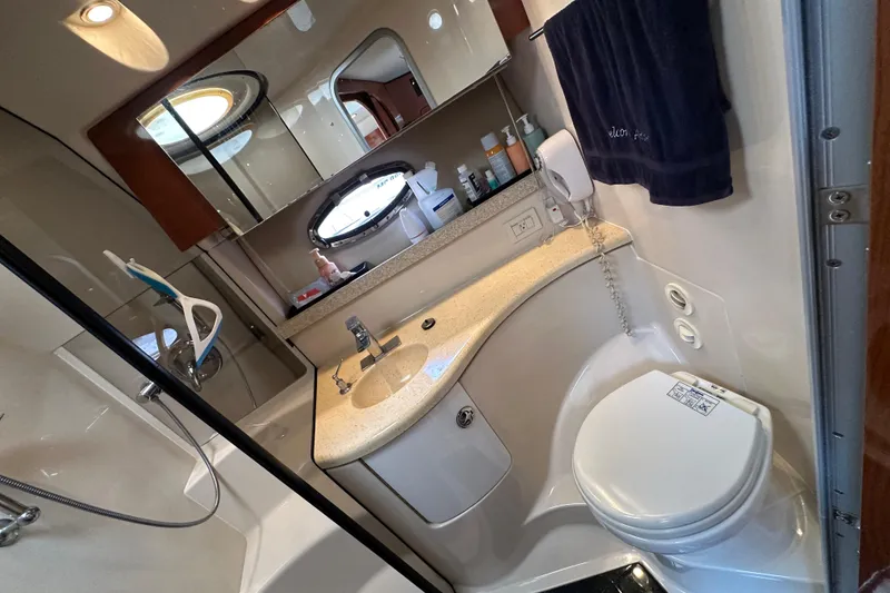Slide: The Image of Luxurious bathroom in 2008 Regal Commodore 4060 yacht with modern amenities and elegant design. - 22