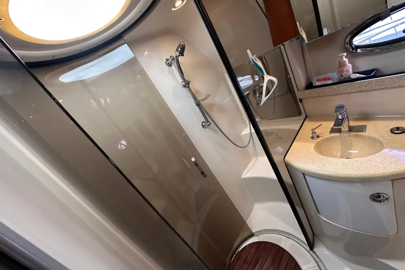 Slide: The Image of Luxurious bathroom in 2008 Regal Commodore 4060 yacht with modern fixtures and elegant design. - 23