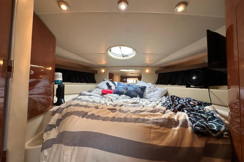 Slide: The Image of Luxurious cabin interior of 2008 Regal Commodore 4060 yacht with cozy bedding. - 20
