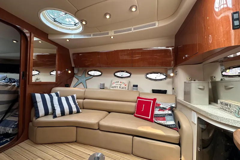 Slide: The Image of Luxurious interior of 2008 Regal Commodore 4060 yacht with plush seating and nautical decor. - 14