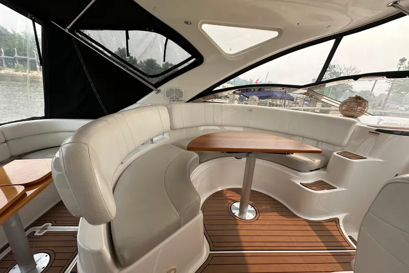 Slide: The Image of Luxurious interior of 2008 Regal Commodore 4060 yacht with elegant seating and wooden table. - 8