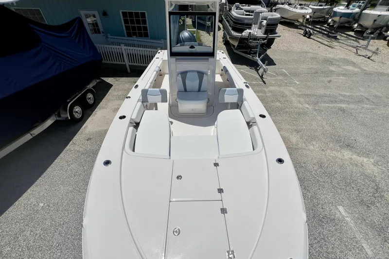 Slide: The Image of 2026 Robalo 246 Cayman boat, top view, showcasing spacious deck and seating area. - 21