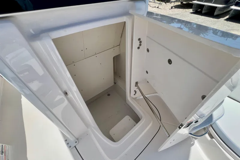 Slide: The Image of Storage compartment of 2026 Robalo 246 Cayman boat, showcasing spacious interior design. - 23