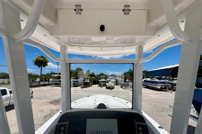 Slide: The Image of Interior view of 2026 Robalo 246 Cayman boat with Garmin navigation system. - 19