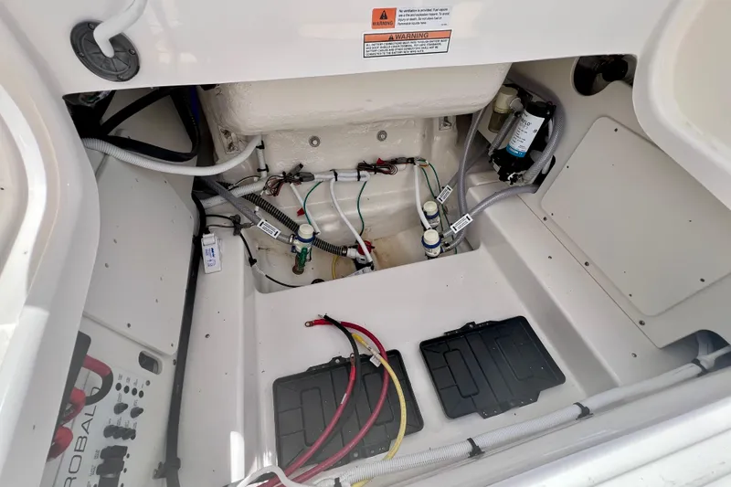 Slide: The Image of Engine compartment of 2026 Robalo 246 Cayman boat, showcasing wiring and components. - 12