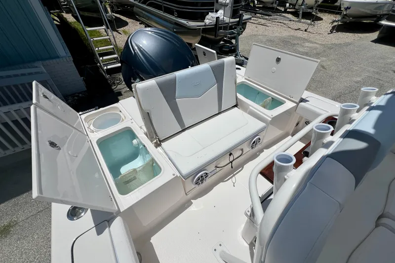 Slide: The Image of 2026 Robalo 246 Cayman boat interior with seating and storage compartments. - 9