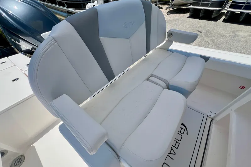 Slide: The Image of 2026 Robalo 246 Cayman boat seat with cushioned armrests and sleek design. - 14