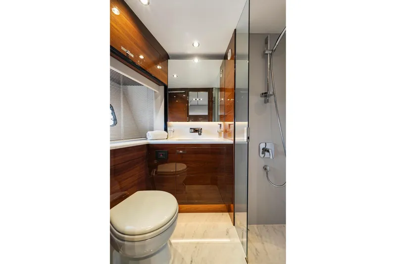 Slide: The Image of Luxurious bathroom in 2018 Princess Y75 yacht with modern fixtures and wooden accents. - 46