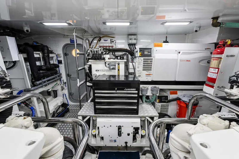 Slide: The Image of Engine room of 2018 Princess Y75 yacht with Husky toolbox and Cummins Onan generator. - 70