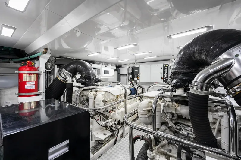 Slide: The Image of Engine room of 2018 Princess Y75 yacht, featuring advanced machinery and fire safety equipment. - 69