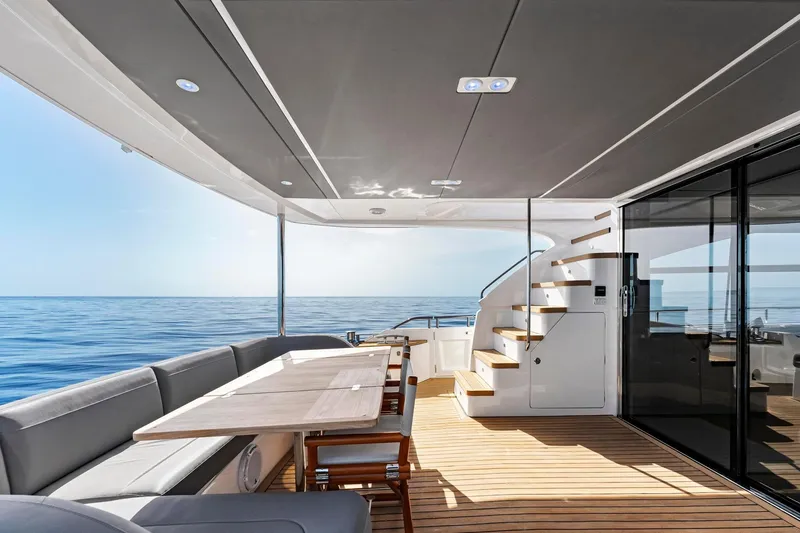 Slide: The Image of Luxurious 2018 Princess Y75 yacht deck with elegant seating and ocean view. - 51