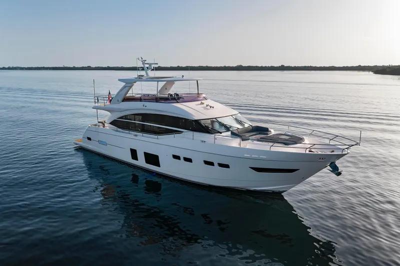 Slide: The Image of Luxurious 2018 Princess Y75 yacht cruising on calm waters at sunset. - 4