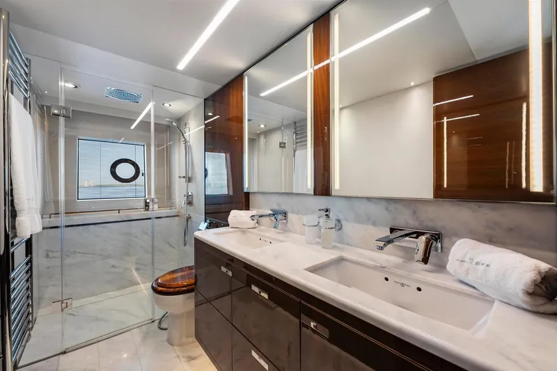 Slide: The Image of Luxurious bathroom in 2018 Princess Y75 yacht with marble and wood finishes. - 29