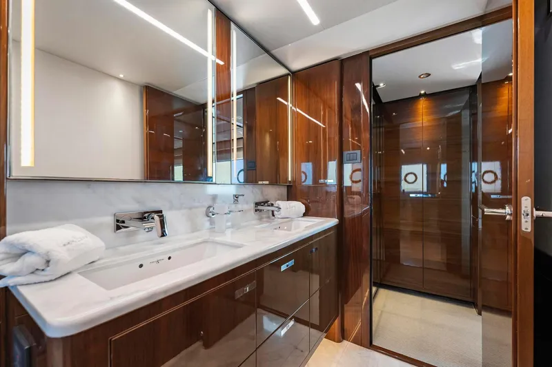 Slide: The Image of Luxurious bathroom interior on 2018 Princess Y75 yacht with dual sinks and elegant wood finishes. - 32