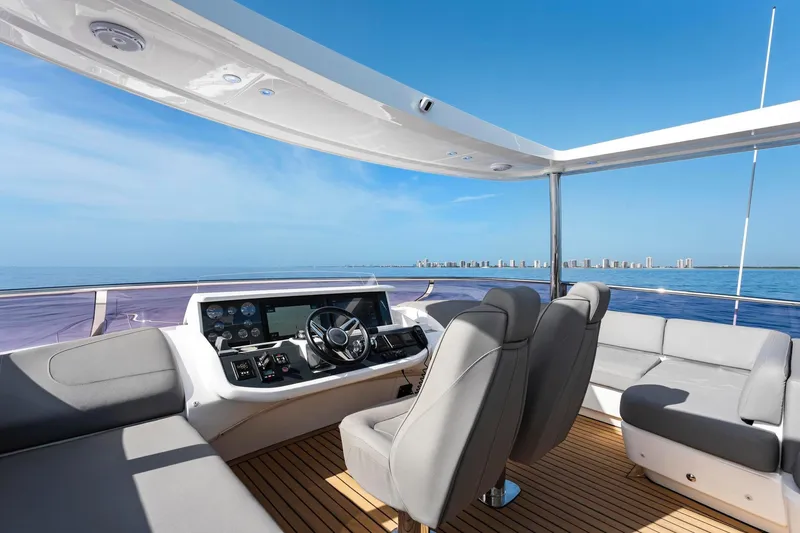 Slide: The Image of Luxurious 2018 Princess Y75 yacht helm with modern seating and ocean view. - 63