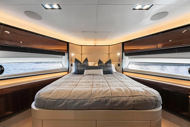 Slide: The Image of Luxurious interior of 2018 Princess Y75 yacht with elegant bedding and panoramic windows. - 33
