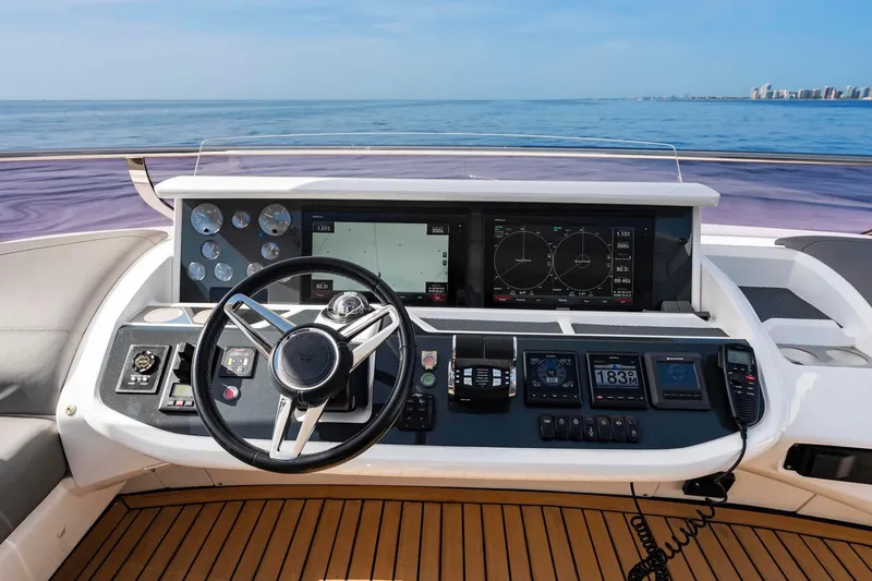 Slide: The Image of Cockpit of 2018 Princess Y75 yacht with advanced navigation controls and ocean view. - 64