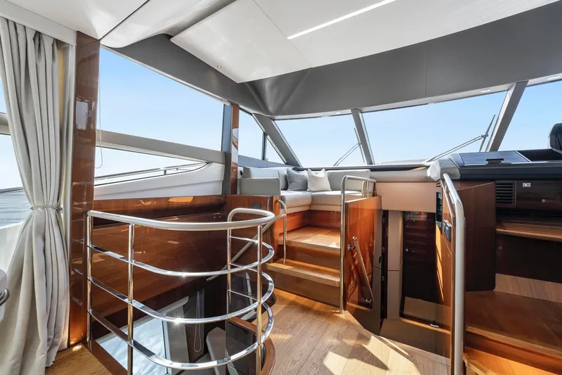 Slide: The Image of Luxurious interior of 2018 Princess Y75 yacht with elegant wood finishes and panoramic windows. - 21