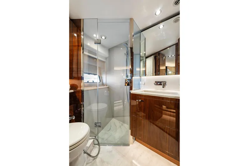Slide: The Image of Luxurious bathroom in 2018 Princess Y75 yacht with glass shower and elegant wood finishes. - 37