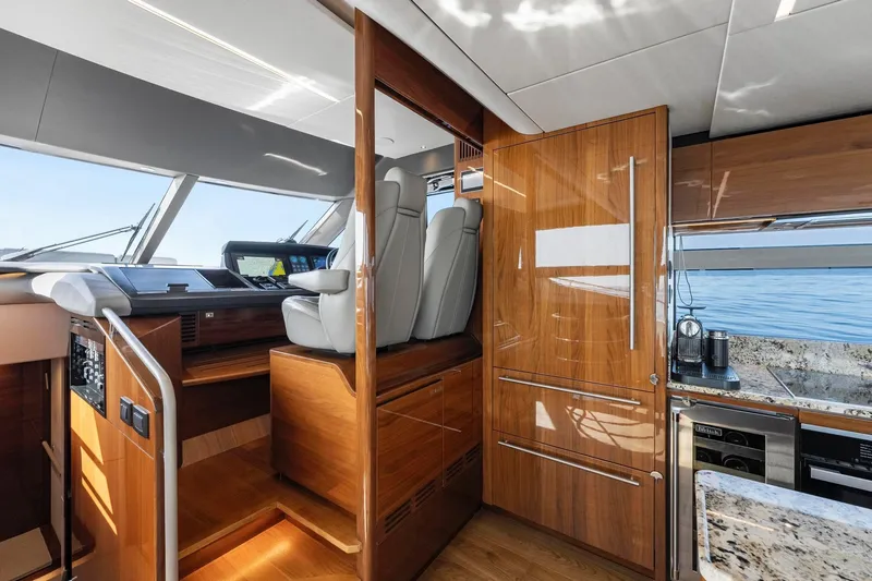 Slide: The Image of Luxurious interior of 2018 Princess Y75 yacht with modern helm and kitchen area. - 17