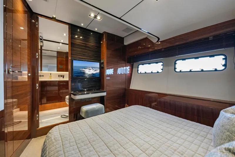 Slide: The Image of Luxurious 2018 Princess Y75 yacht cabin with elegant wood finishes and modern amenities. - 40