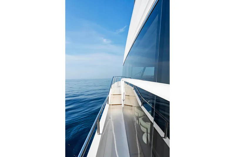 Slide: The Image of Side view of 2018 Princess Y75 yacht on calm ocean waters. - 65